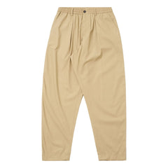 Universal Works - Pleated Track Poly Tech Trousers | Beige