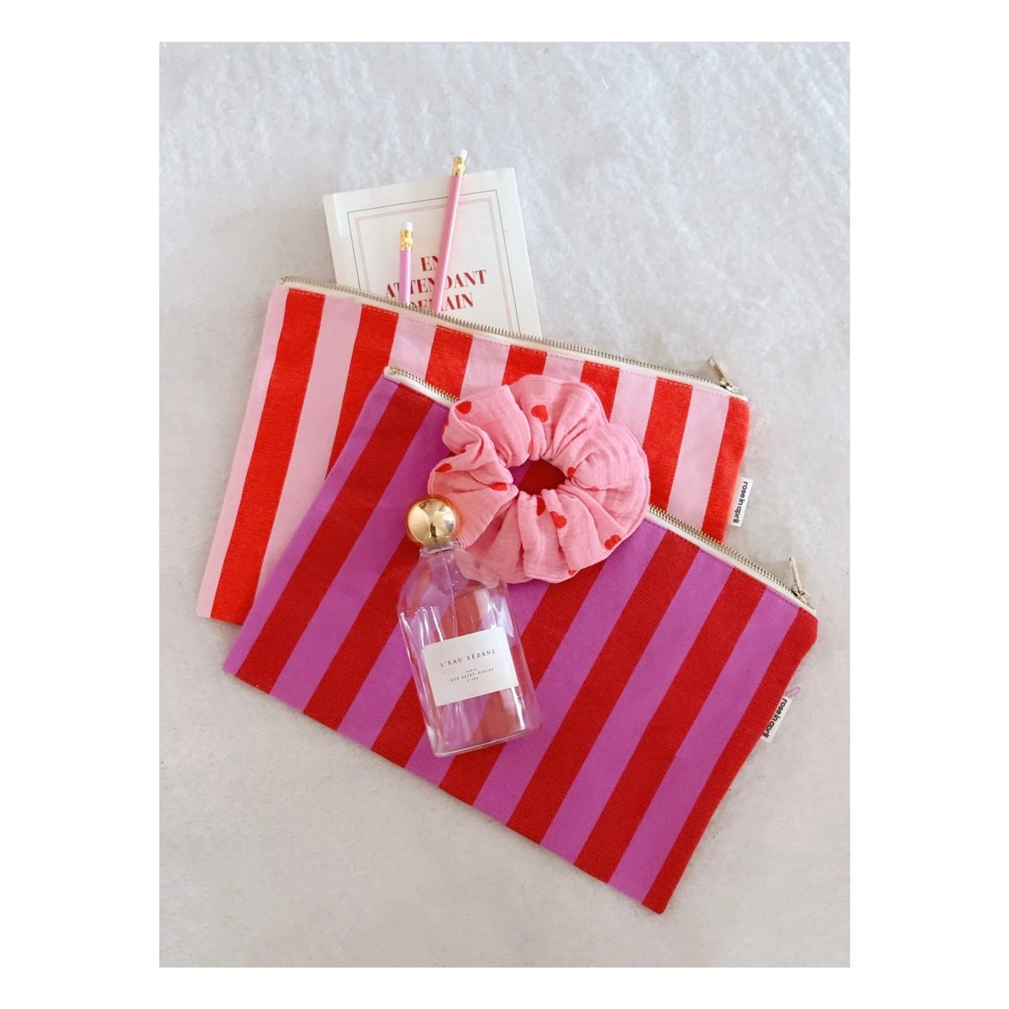 Rose in April - Lili striped clutch bag | Pink